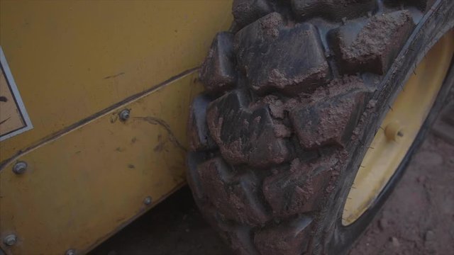 slowmotion bobcat whell close up
