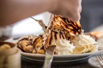 Crepe ice cream, with chocolate ingredients, banana, whipped cream , Make the taste colorful to eat.
