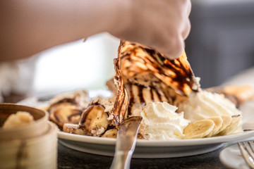 Crepe ice cream, with chocolate ingredients, banana, whipped cream , Make the taste colorful to eat.
