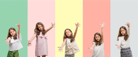 Obraz premium Collage of brunette hispanic girl wearing different outfits looking at the camera smiling with open arms for hug. Cheerful expression embracing happiness.