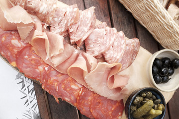 Cold cut of parma ham or iberico with cucumber pickles and bread