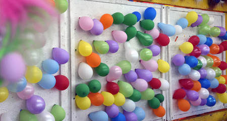 Colorful balloons on wall
