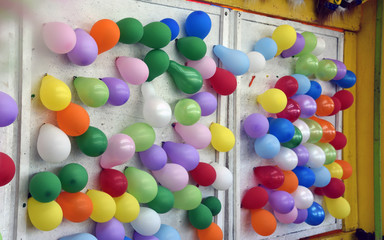 Fototapeta na wymiar Colorful balloons on wall