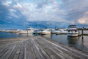 Boats on the waterfront at sunset in Fells Point, Baltimore, Maryland