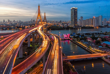 Fototapeta na wymiar The Bhumibol Bridge (Industrial Ring Road Bridge) (Bangkok, Thailand) Beautiful view at twilight, Bangkok Expressway top view, expressway and motorway at night Aerial view from drone