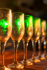 White wine pouring into glasses, close up view