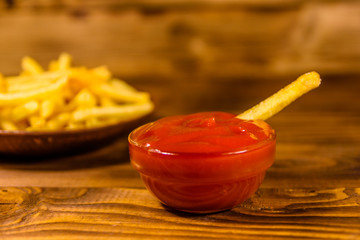 Fresh french fry dipped into the tomato sauce