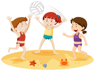 Three girls playing with a ball at the beach