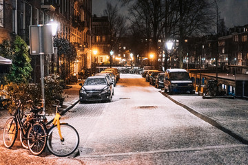 Obraz premium Bicycles parked along the road, night