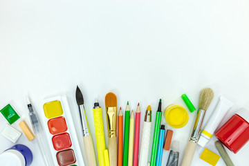 school painter tools on white background. watercolor paints, pencils, crayons flat view