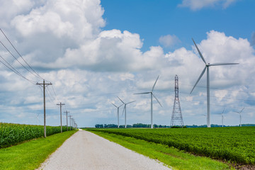 Fototapeta na wymiar Road and windmills in rural Indiana