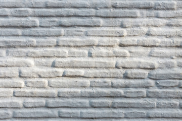 Horizontal brick wall background, white facade of the house