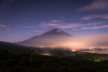 Nightscape of Mountain Fuji with cloud at Yamanaka lake
