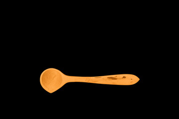 wooden spoon boxwood handcraft work on black background