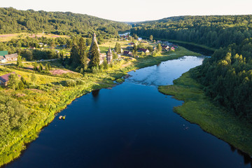 Fototapeta na wymiar Top view of Vazhinka river in Soginicy village. Green forests of Leningrad region and Republic of Karelia, Russia.