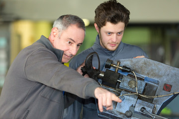 apprentice working with enginee