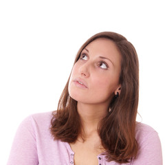 Fototapeta premium thoughtful young woman looking up, isolated on white
