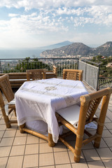 Prepared for supper table on the terrace overlooking the Bay of Naples and Vesuvius. Sorrento. Italy
