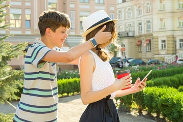 Couple of teens are having fun in the city, summer holidays, education, teenage concept.