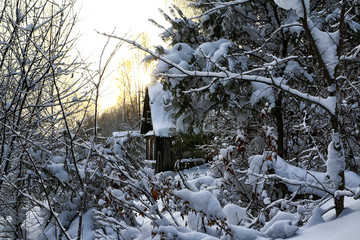 Typical russian abandoned snow-covered village in winter day