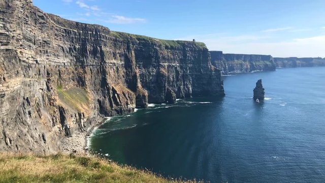 The famous Cliffs of Moher are sea cliffs located at the southwestern edge of the Burren region in County Clare, Ireland. They run for about 14 kilometres.