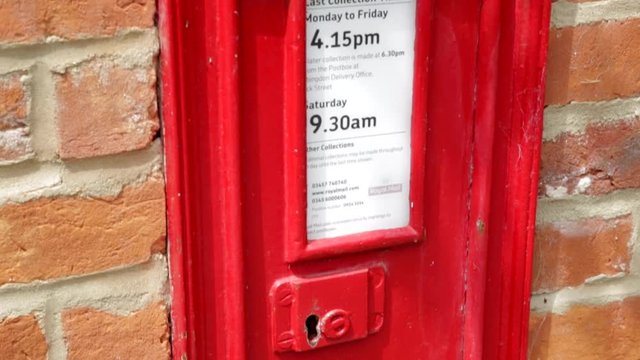 Victorian red letterbox close up tilt shot