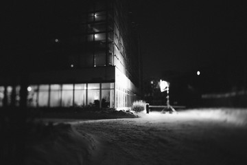 Moscow, Russia. Cinematic light is on the street. Filming on the first floor of a glass building. Black and white photo