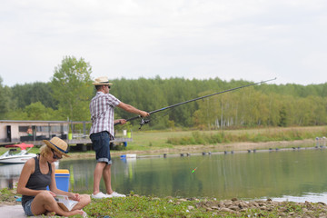 couple fishing on a lake