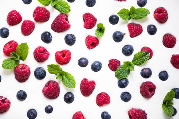 Food background, raspberries and blueberies on yogurt