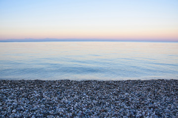 Beautiful Sea View. Pebbles, Sea and Sky. Sunset