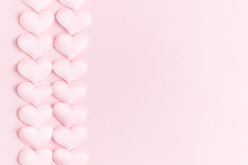 Valentines day background with hearts pink silk, copy space. Valentine day concept for design. Flat lay, top view, copy space 