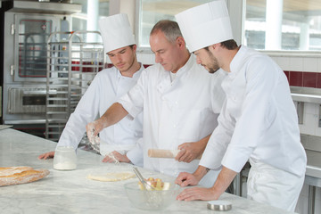 young cook students in training course