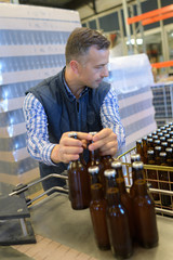 man in bottling plant