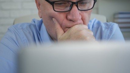 Businessman In Office Room Looking Worried Study Electronic Documents