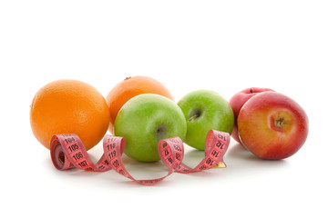 Fruits and measuring tape on white background. Diet food