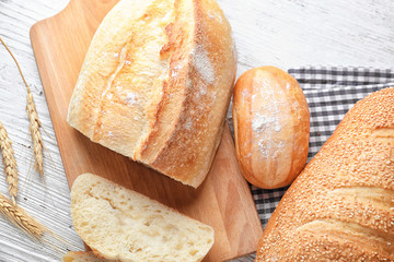 Different bakery products on wooden background