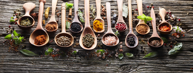 Herbs and spices on wooden board