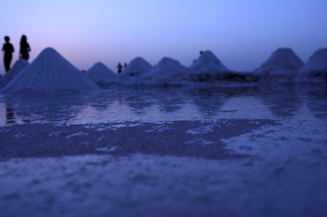 Magic sunrises on the surface of a salt lake in the Great Sahara. Ultraviolet coloring. Tunisia. Africa