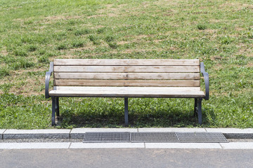 Wooden bench in the park in summer