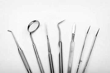 Dentist's tools on white background