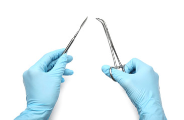 Dentist with tools on white background