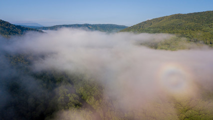 Epic Aerial Flight Through Mountain Clouds. Sunrise Beautiful Morning.