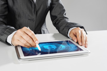 Internet security concept with woman working on media screen with stylus