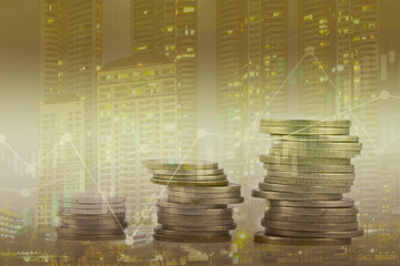 Double exposure of city with stock market graph and rows of coins , Business analyzing financial statistics Finance concept