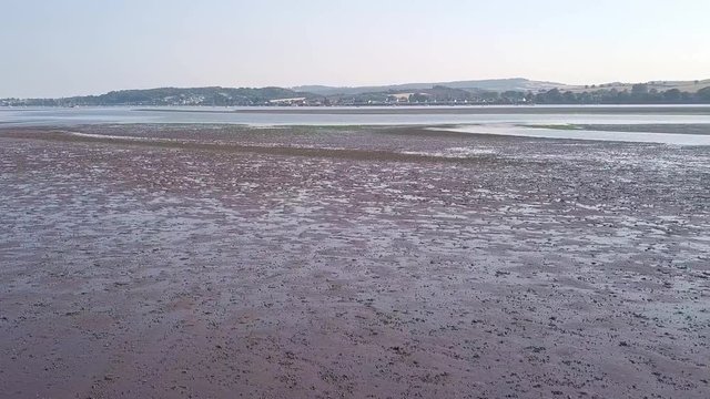 Slow tilt up of The Ridge and River Exe, Lympstone. Aerial footage.