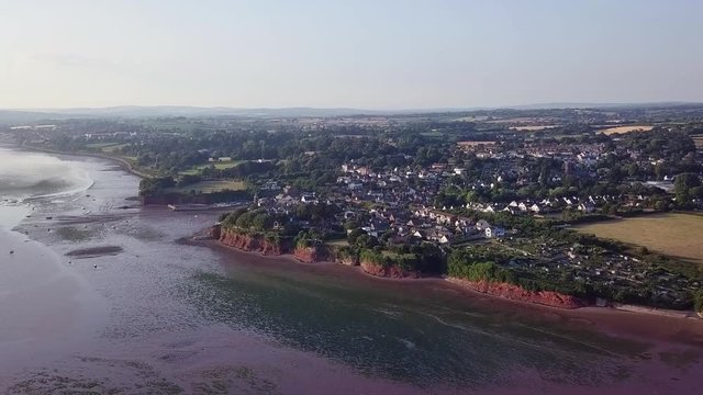 Wide aerial, establishing shot of Lympstone estuary and town. Seascape and landscape.