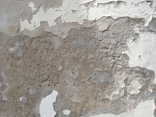 Texture of a stone wall. Old wall background. Stone wall as a background or texture. Corrosion on a stone wall.