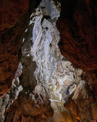 stalactites and stalagmites in underground cave entrance