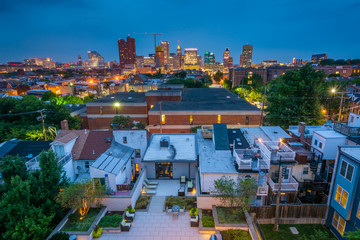 View of Federal Hill and downtown at night in Baltimore, Maryland
