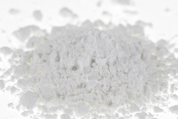 Fototapeta na wymiar Pile of wheat flour isolated on white,farina